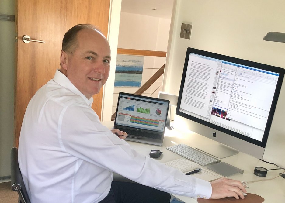 Michael Olliff, managing director, Scott Brownrigg, analysing business data from his home office.