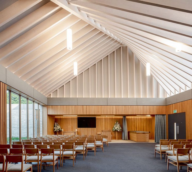 The main chapel with walled courtyard on the left and catafalque on the right. East clerestory light accentuates the roof structure.