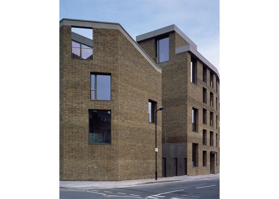 The corner townhouse becomes a robust, sculptural form that turns the corner to the apartments.