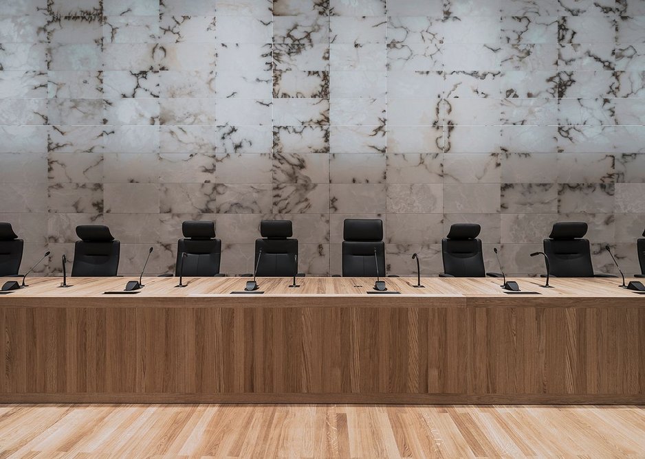 Judges sit in front of a backlit wall of alabaster.