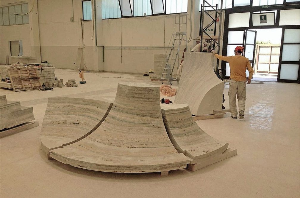 Fabricating the elegant curves of the travertine staircase.