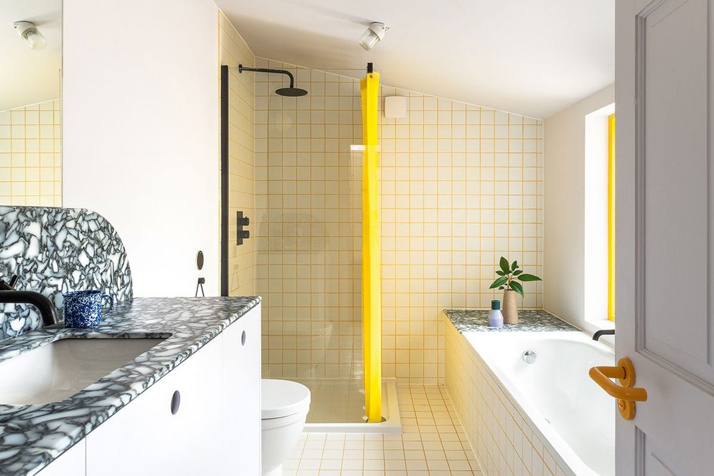 The bathroom, with just a shot of yellow, looks tame by comparison.