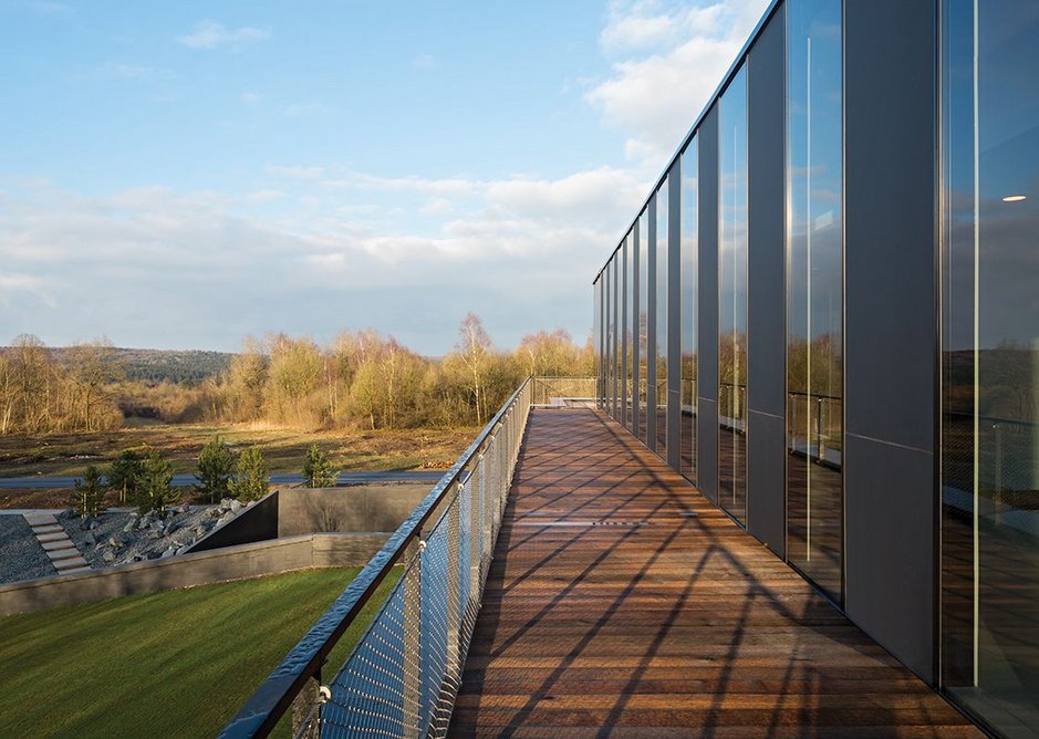 Four open terraces on the new top level give visitors 360-degree views across the forest toward the ossuary, scarred landscape and beyond