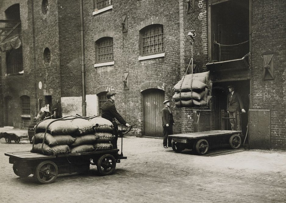 Sugar arriving by electric truck for loading into warehouse, West India Dock.