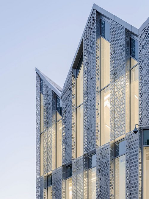 Patterned aluminium façade panels cast striking shadows inside Coffey Architects’ 22 Handyside Street, created in collaboration with Fleetwood Architectural Aluminium.