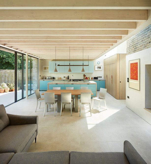 A continuous glazed slot articulates the junction of old and new.