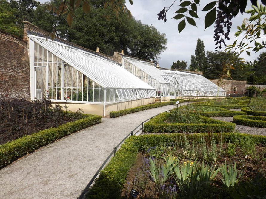 Alitex replica curved greenhouse at Fulham Palace House and Garden, London.