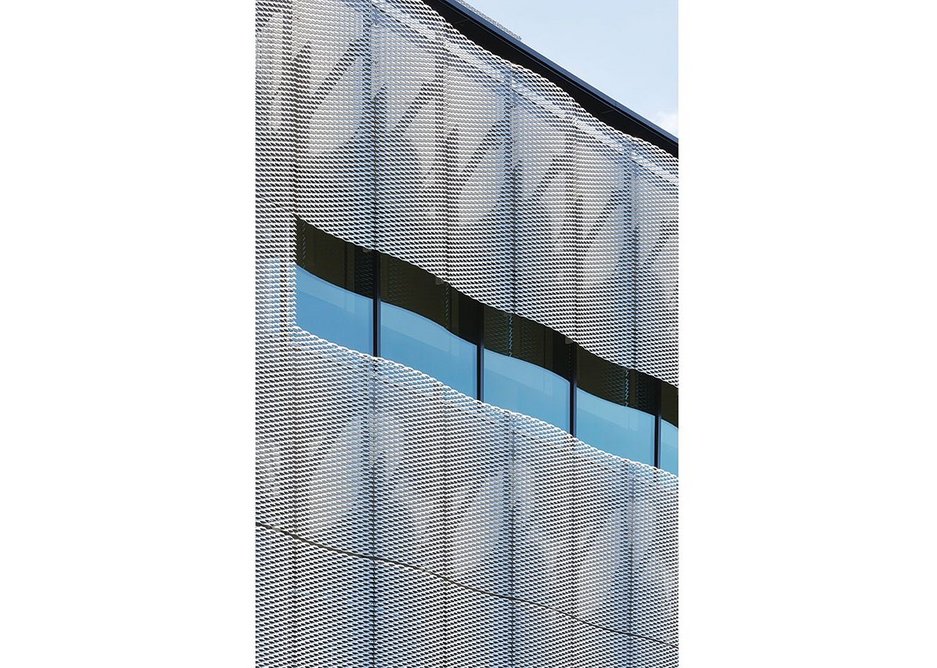 A sense of movement is provided by the sinusoidal perforated aluminium cladding.