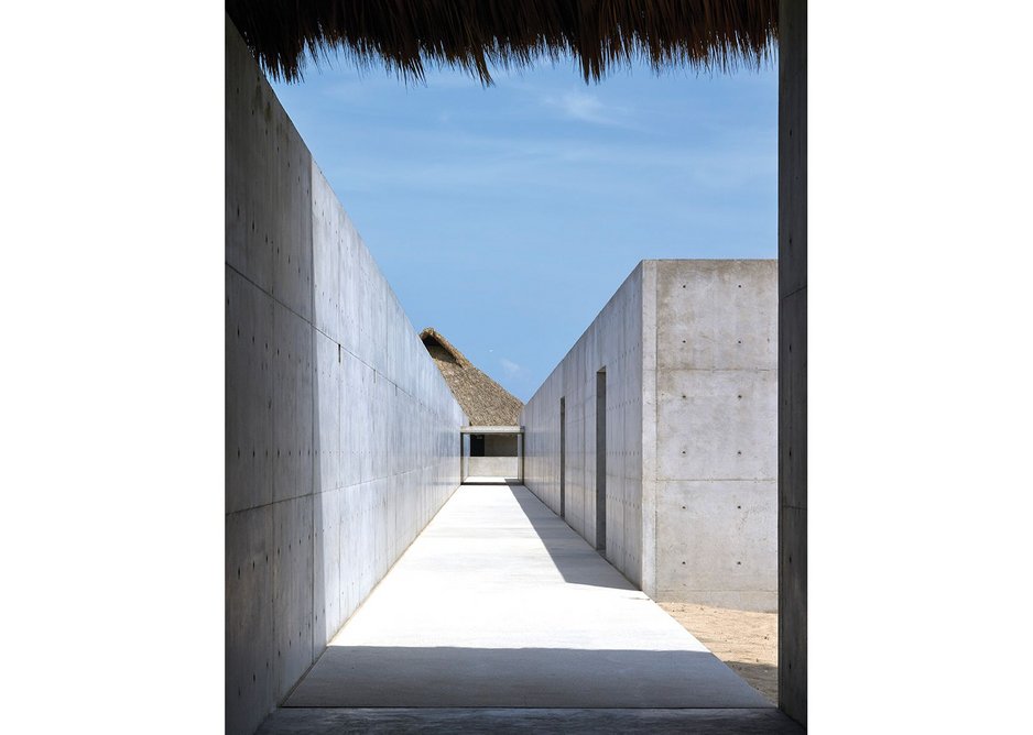 View towards the ‘Large Villa’. The 300m long wall separates public from private areas. The concrete box on the right accommodates office and gallery space.