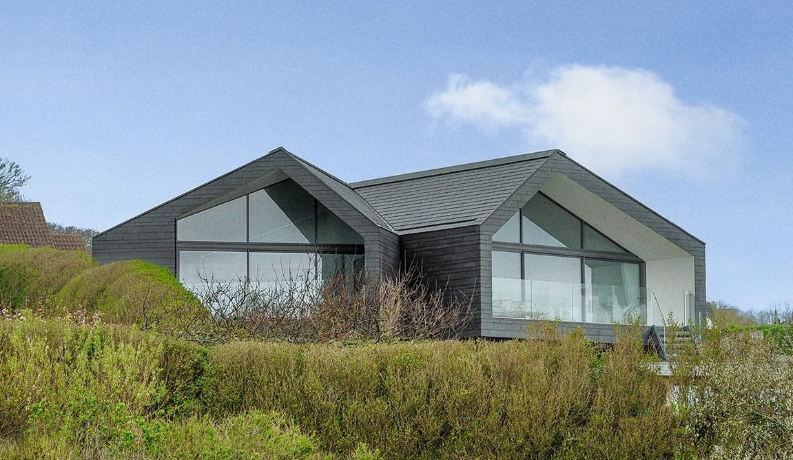 From the beach, the angled gable ends give the impression of two single-storey detached bungalows.