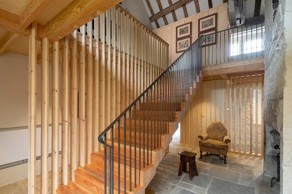 Softwood slats line the former cross passage and new glulam staircase.