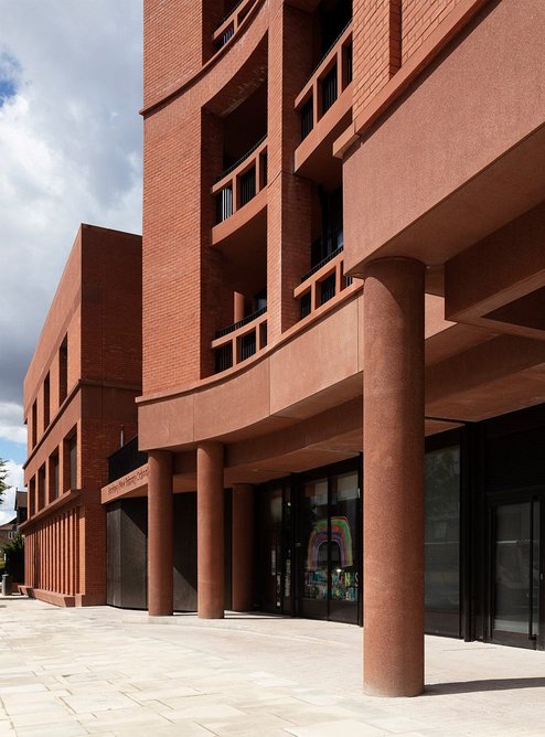 The colonnade helps set the retail units back from the street at Hackney New Primary School and 333 Kingsland Road.