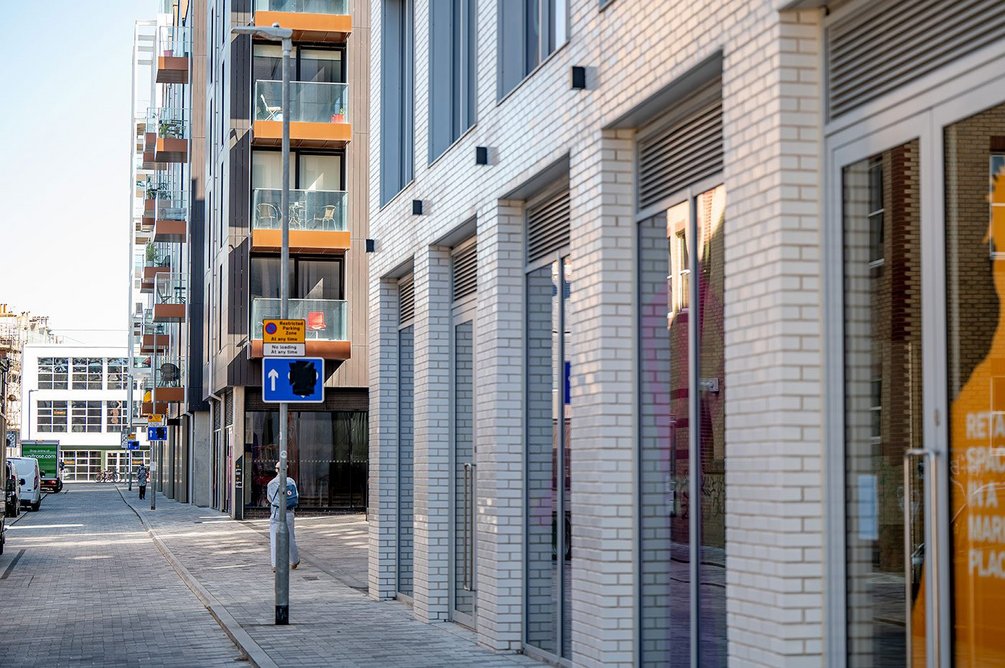 Office and residential buildings frame the main entrance to the site on Circus Street.