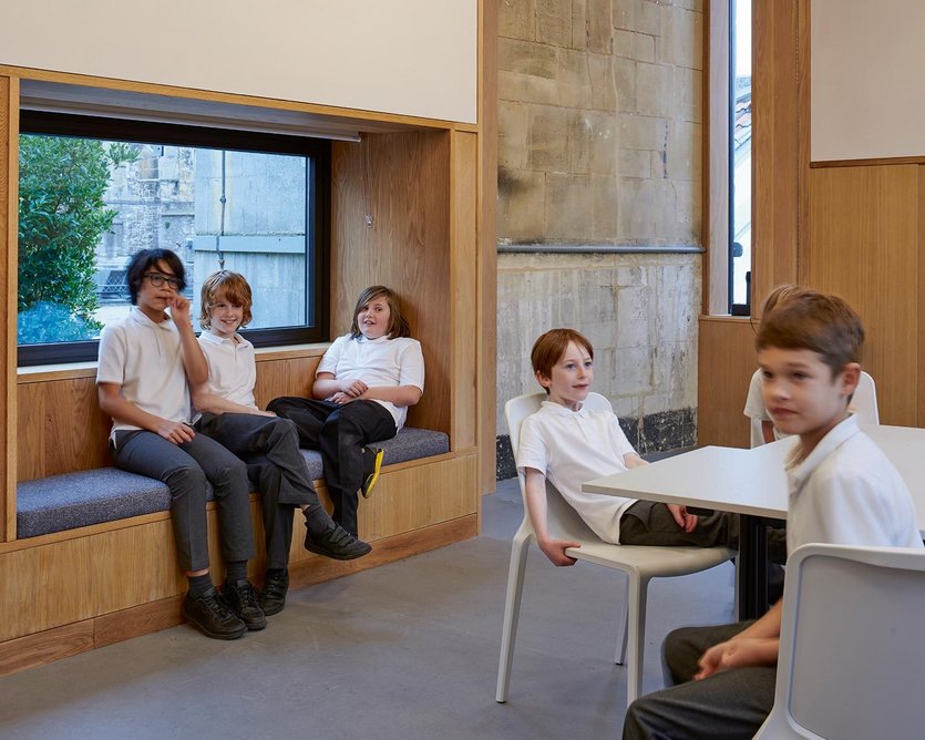 Deep window reveals and inhabitable window seats reveals in the lunch room.