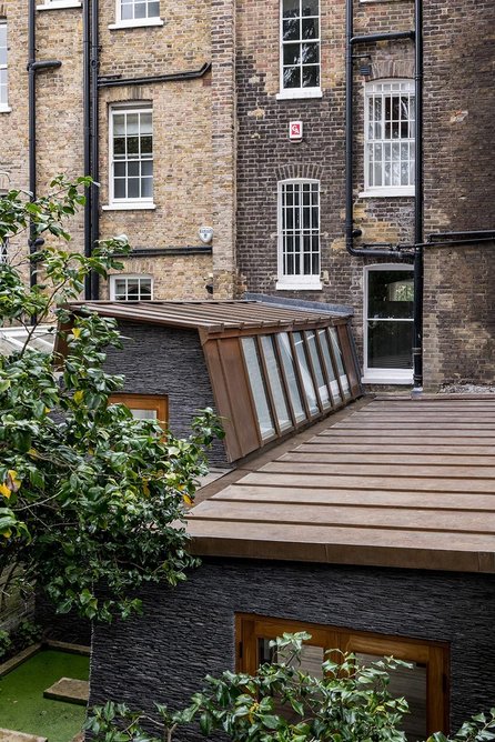 The copper roof, slate and lime render used on the exterior will patinate to blend in with the garden environment.