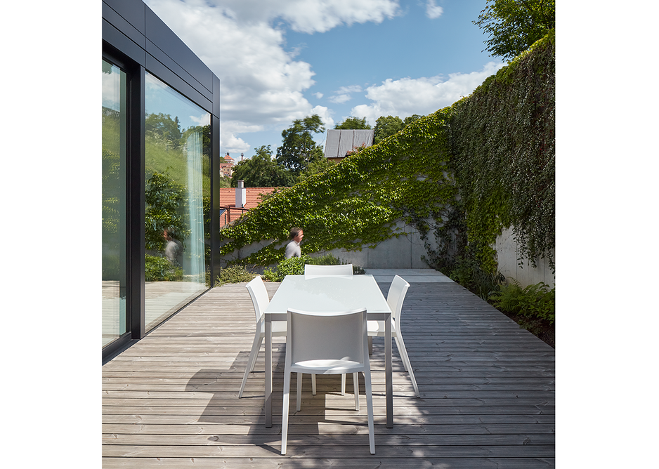 Outdoor social space leads off the upstairs living space.