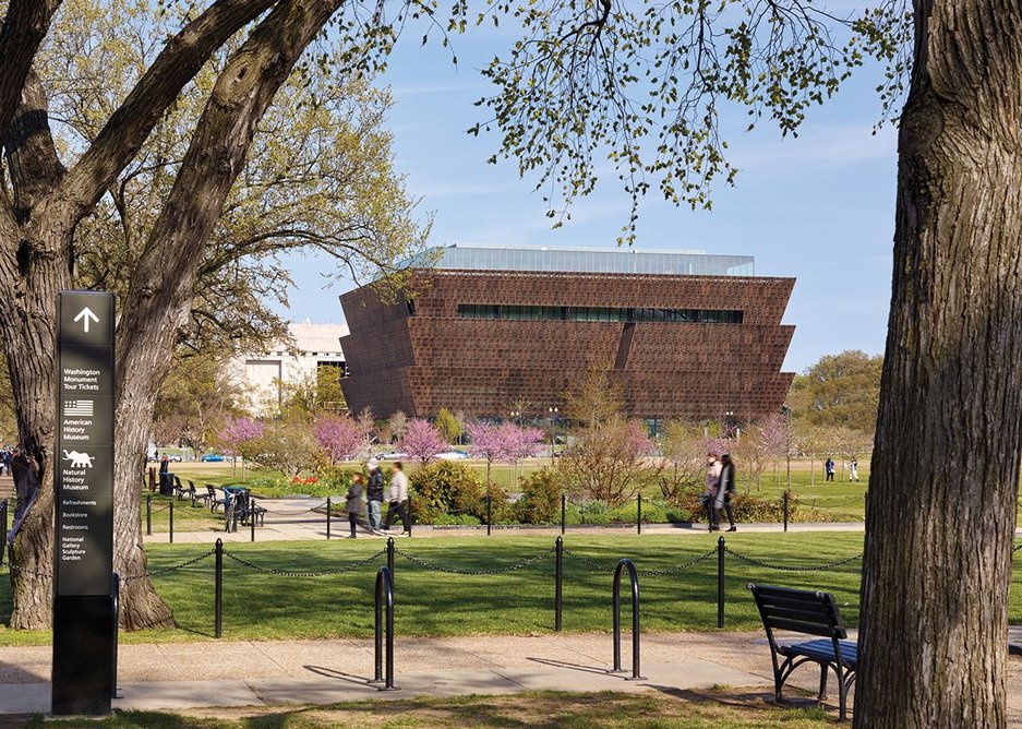 The inverted ziggurat of the NMAAHC from the National Mall Memorial Park, looking east.