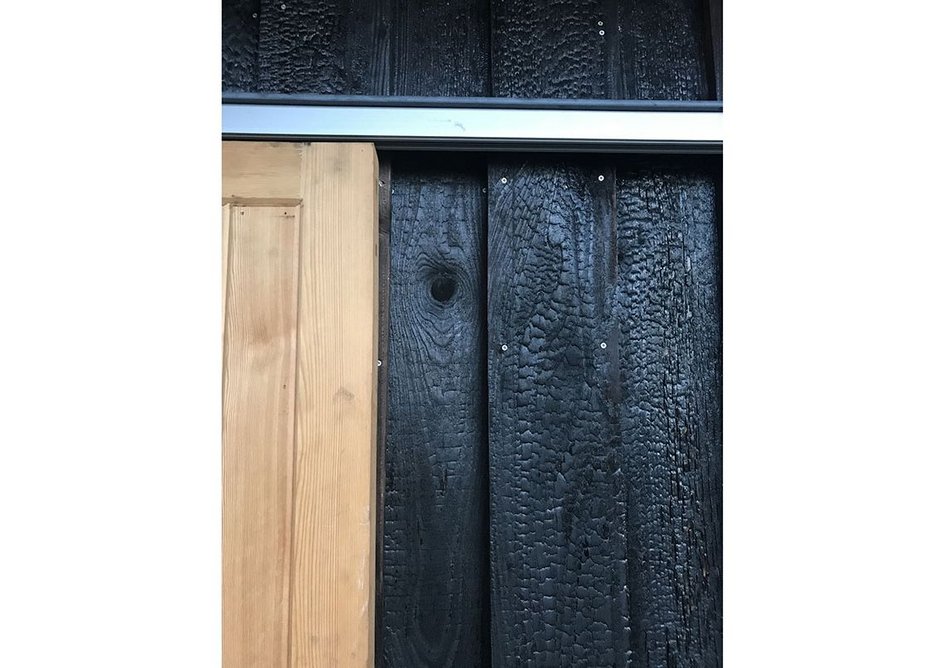 Charred timber on the exterior of the extension.
