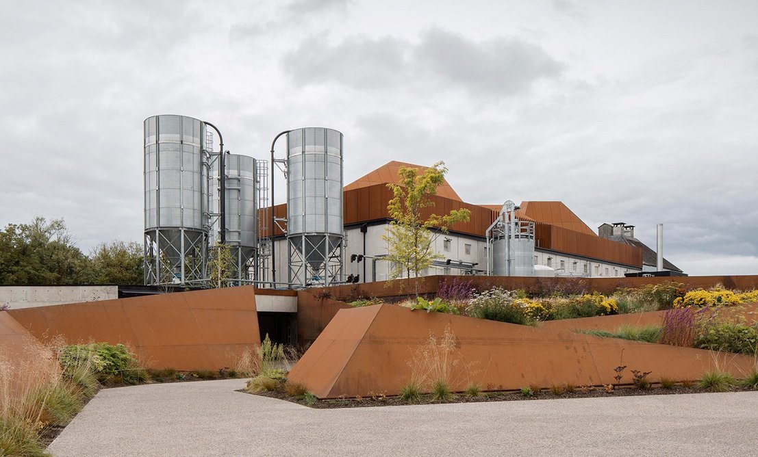 Weathering steel extends into the landscape, where visitors are guided through beds of barley, wheat and long grasses.