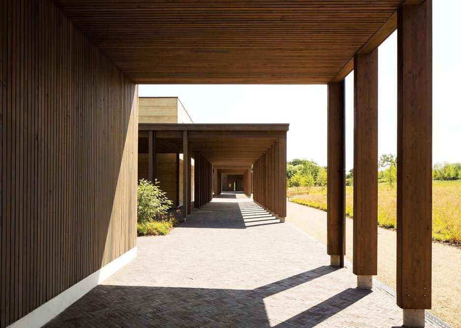 A covered walkway built from larch glulam provides a processional route for the burial.