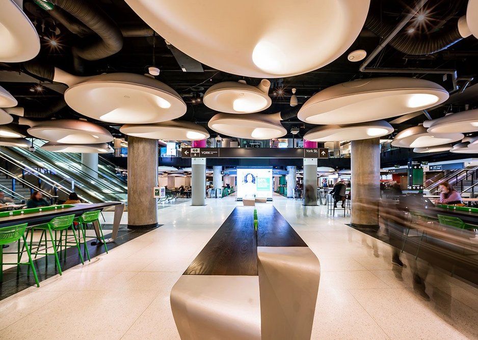 Ear-like blobs integrate air conditioning, light, loudspeakers and acoustic insulation in the food court at Union Station.