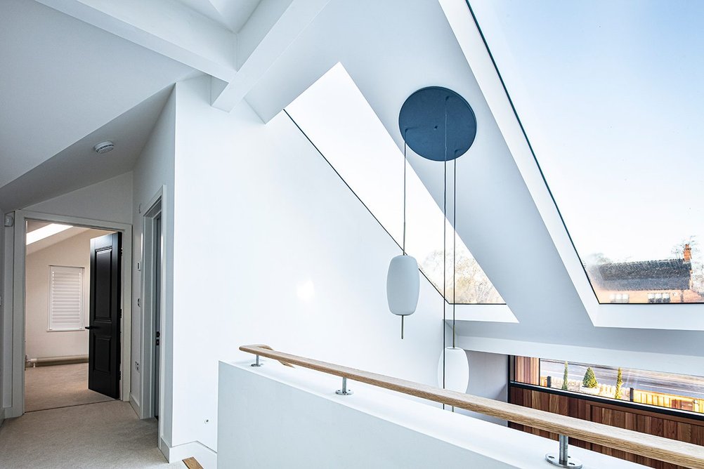 Two Glazing Vision Pitchglaze Roof Windows fitted above the double-height entrance.