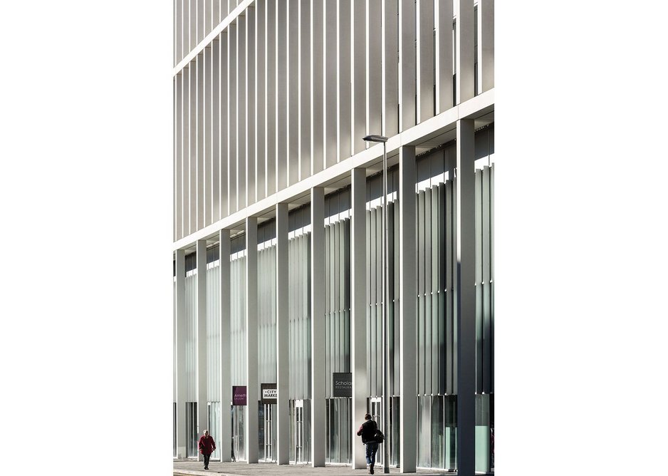 Layered gridded façade creates a civic language that addresses and activates cathedral street