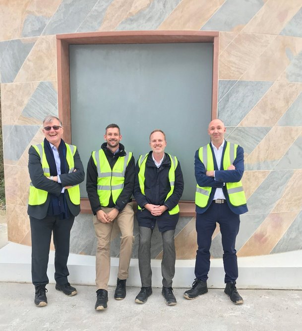 Mock-up of stone for the new quad at New College, photographed at Cadeby Quarry, nr Doncaster. L to R: Richard Bayfield, New College Project Director; Gez Wells, New College Home Bursar; David Kohn, Architect; Tim Leigh, Project Manager, Ridge and Partners.
