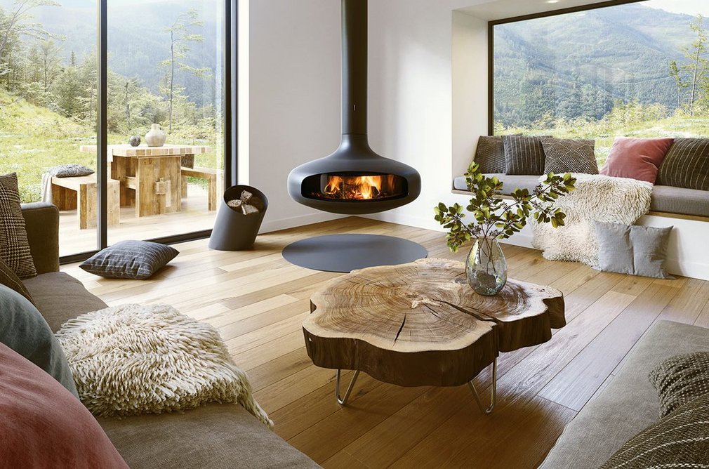 The Glazed Domofocus: A central glazed wood fireplace with suspended and pivoting hearth.