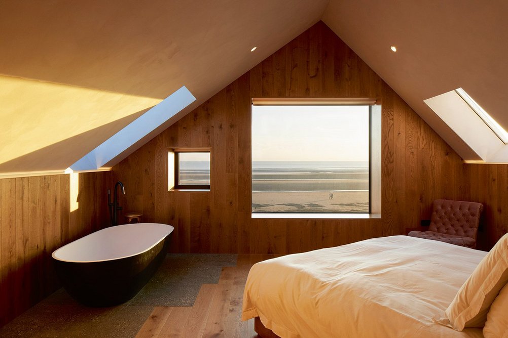 Master bedroom with Lusso Stone free-standing bath, which required steelwork in the structure around that corner.