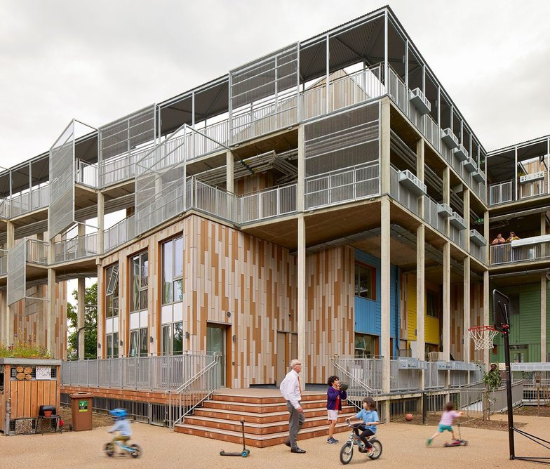 A communal laundry looks onto the raised deck.
