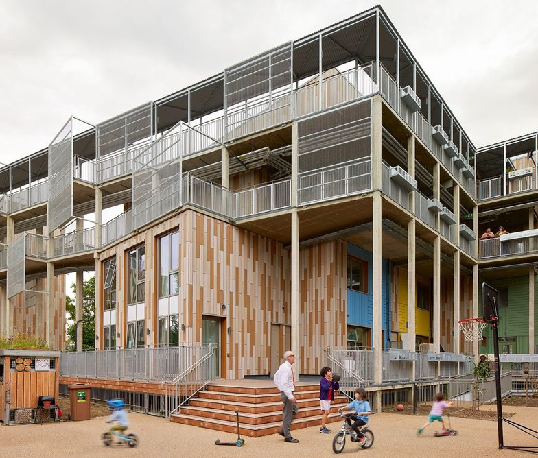 A communal laundry looks onto the raised deck.