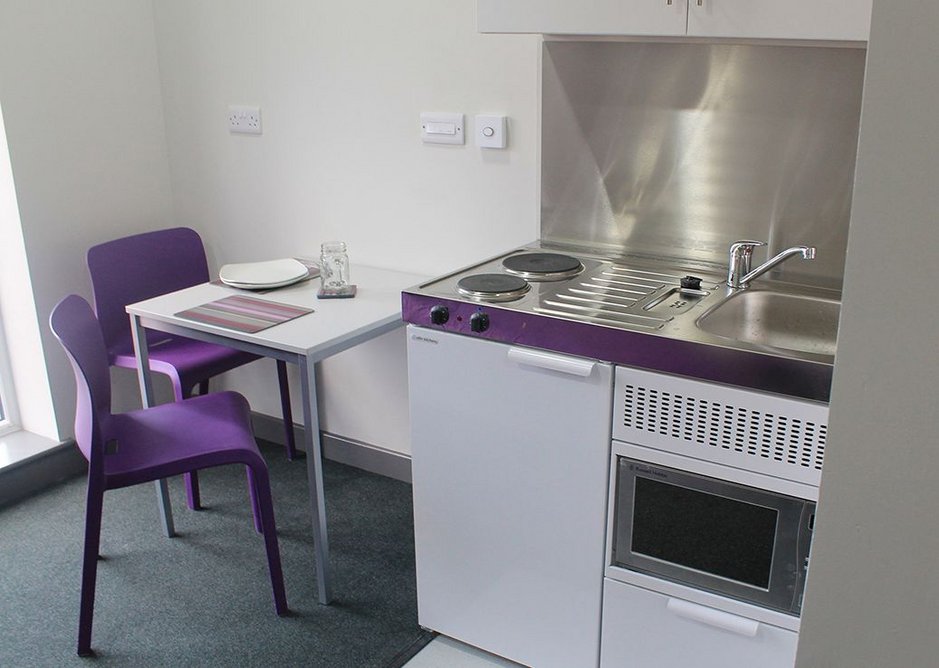 Elfin specially designed extra wide kitchen units for Poulson House's accessible apartments, featuring height-adjustable worktops and flexible waste pipes.