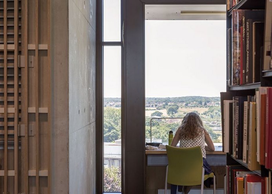 Timber slats on walls help mask the exhaust louvres for the naturally ventilated main library.