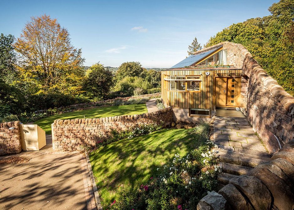 From the entrance side – sycamore clad kitchen in foreground.