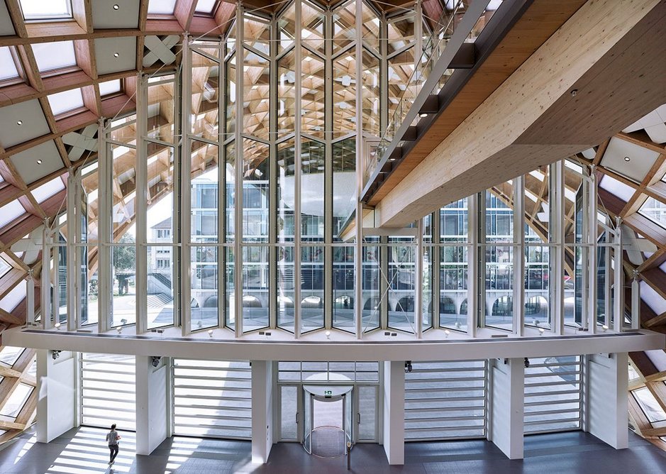 Timber gridshell stretches over a highway to join up with Shigeru Ban’s 2017 museum and exhibition centre.