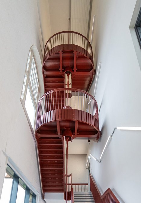 New staircase in the transmission block with new first floor aluminium-framed double-glazed picture window at bottom left.