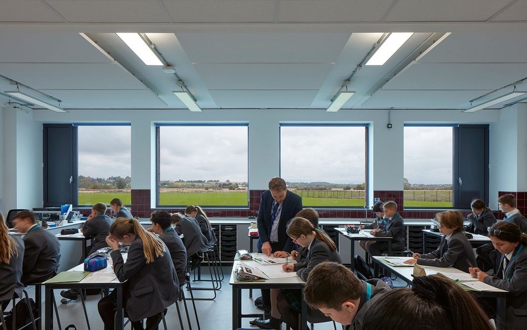 View looking north to the sports field through the new blocks’ triple-glazed, fixed light windows. Note the opening vent panel to the left.