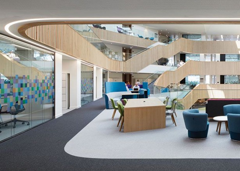 Terraces of flexible space follow the diminishing floor plates down in the central atrium.