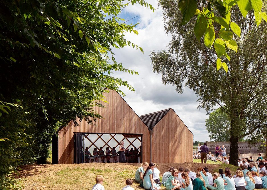 St. John's School Music Pavilion designed by Clementine Blakemore Architects at Lacey Green, Buckinghamshire. Bi-folding doors open the space up to the school landscape.