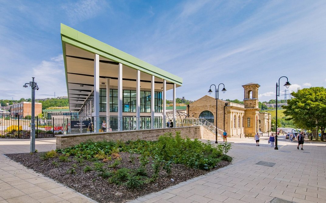 The new structure adjoins the former Sion School, now a station entrance.