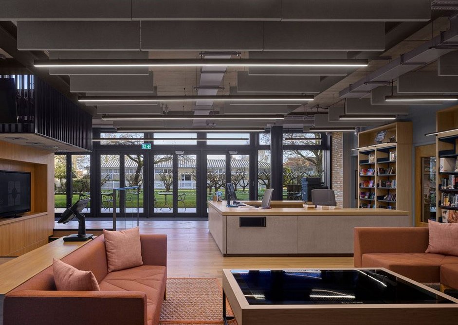 The check out desk facing into the library and the orchard.