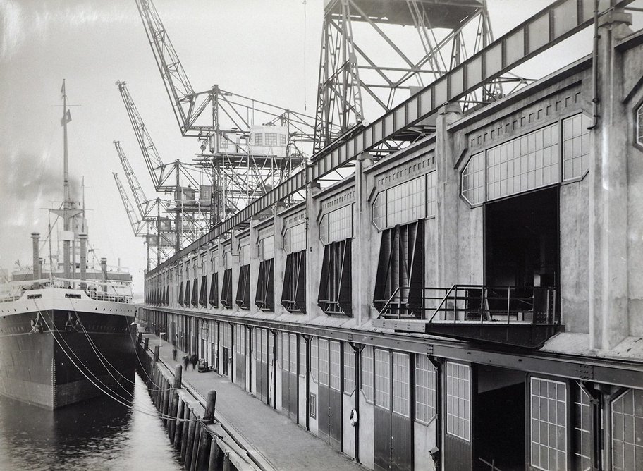 A ship docked beside the Holland-America line’s warehouse in Rotterdam, c.1925.
