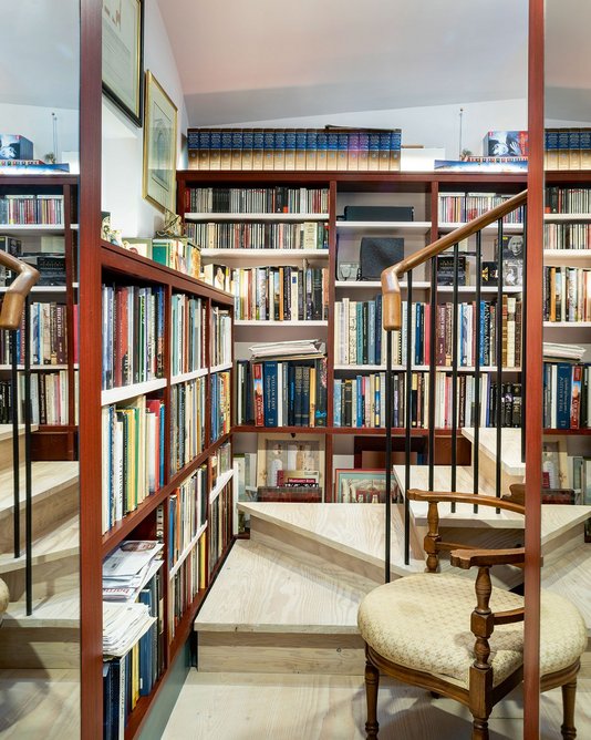 The steps down from the main basement into the former coal store, which have been joined together to make an office for one of the clients, also housing his collection of architectural history books..