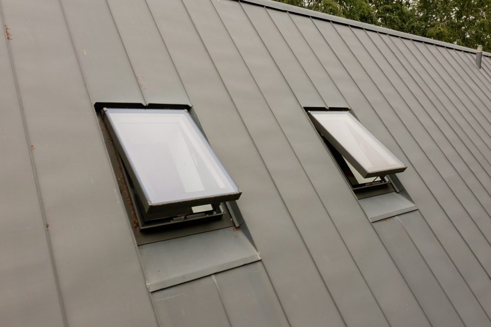 The Rooflight Company's Neo rooflights. They are top hinged rather than centre-pivoted for an authentic appearance and to maximise the space below.