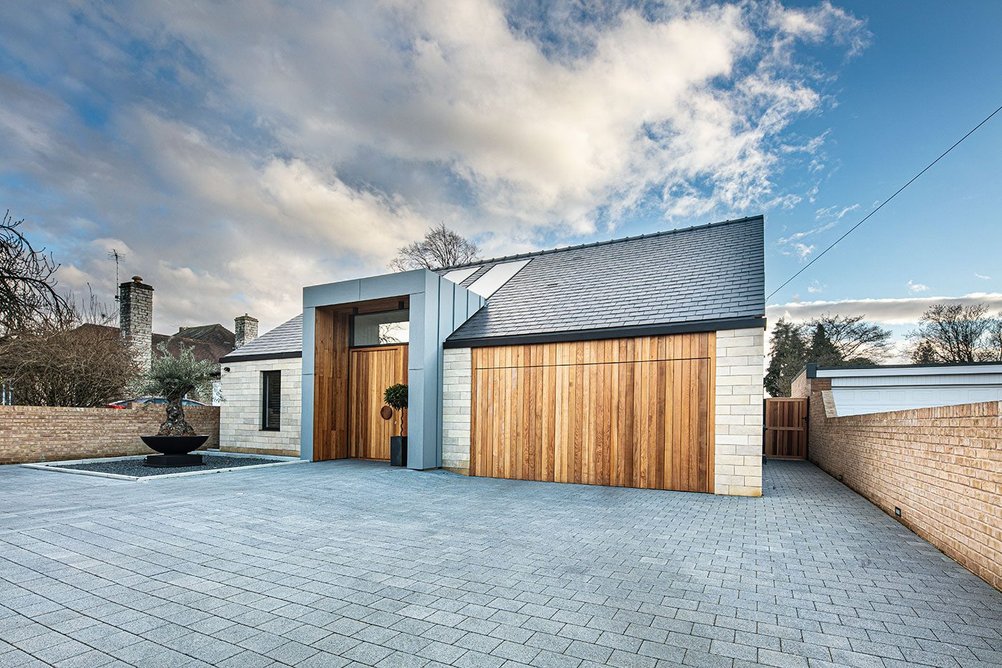 A toning colour palette warmed by larch-clad doors.