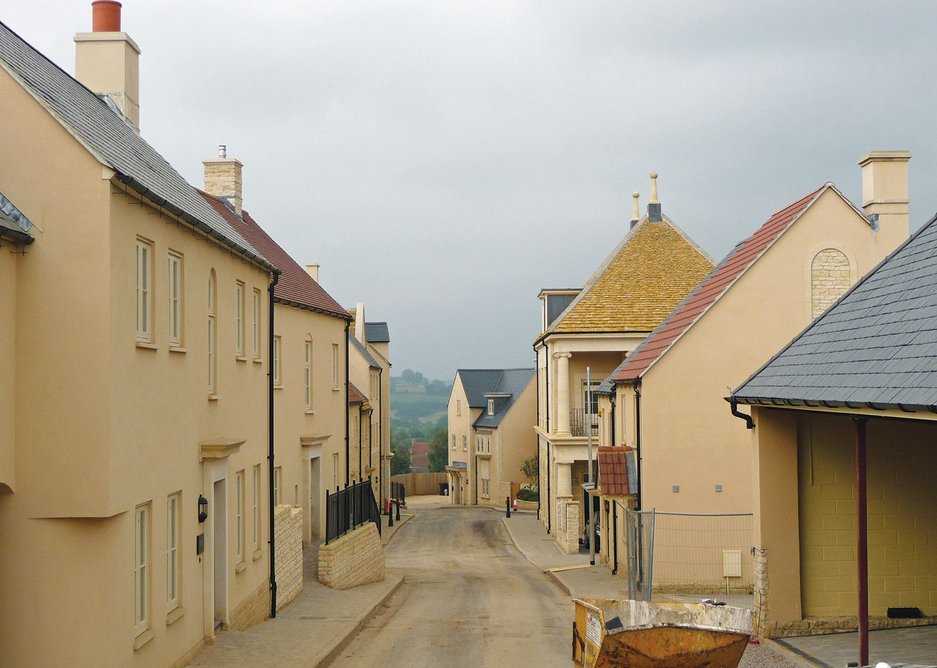 Brand new old village under construction: plainer houses line the street uphill from the costly ‘market hall’