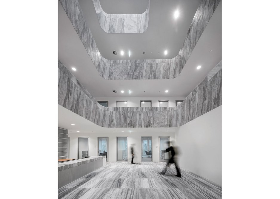 Vertical striations in the marble give civic gravitas to the Council of Judges’ atrium.