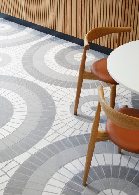 Detail of patterned porcelain floor created in collaboration with Sam Frith of Solus Ceramics at HYLO, a retrofit of a 1960s office.