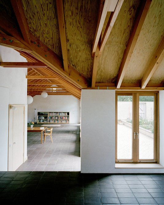 The Douglas fir roof structure is exposed throughout.